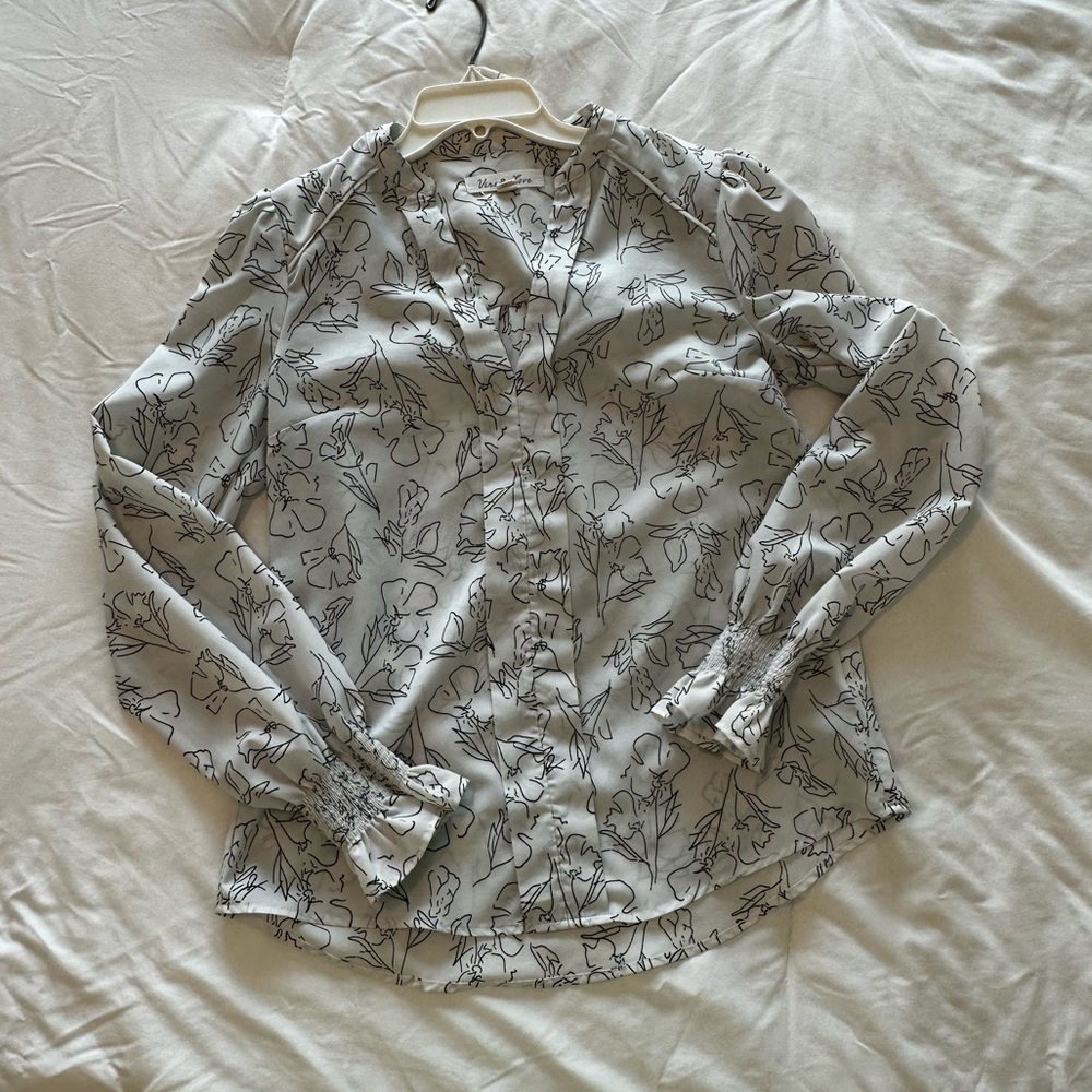 White collarless blouse with black flower detailing